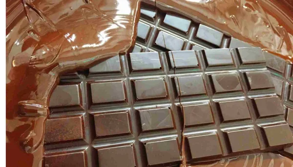 Can Chocolate Be Good For You? Handmade Irish Chocolate High Cocoa Content Dark chocolate bars melting into liquid chocolate.