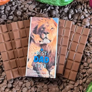 'Best Dad Ever' Milk chocolate bar gift on chocolate bars without packaging and on top of a bed of chocolate drops.