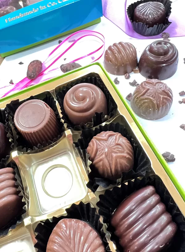 'Moments' Milk Chocolate Assortment tray on a white countertop.