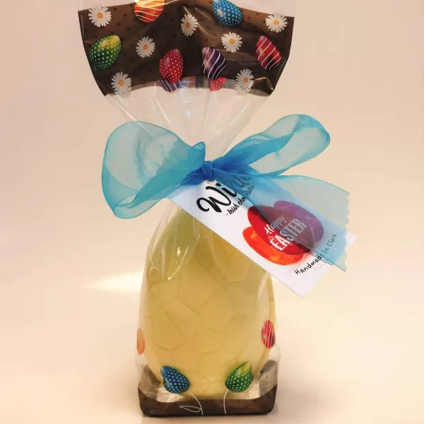 White chocolate praline filled Easter egg in its packaging.