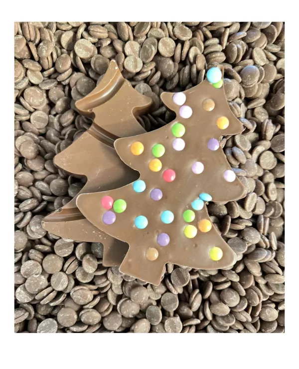 Dotty Milk Chocolate Christmas Tree is placed on a bed of chocolate drops.