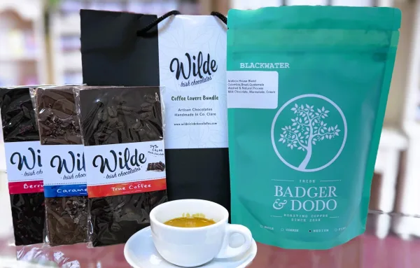 Badger& Dodo Blackwater Blend coffee pack with Wilde Irish Chocolate artisan basr and an expresso drink