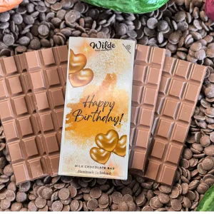 Happy Birthday Golden Hearts Chocolate Gift Bar on bed of chocolate bars
