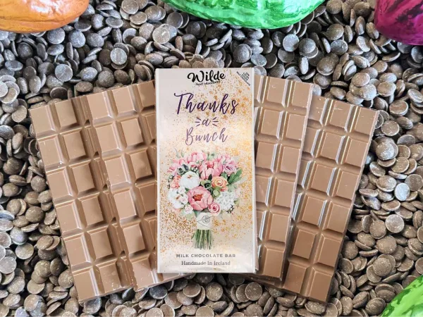 Thanks A Bunch chocolate gift bar on chocolate bars with chocolate buttons in the background