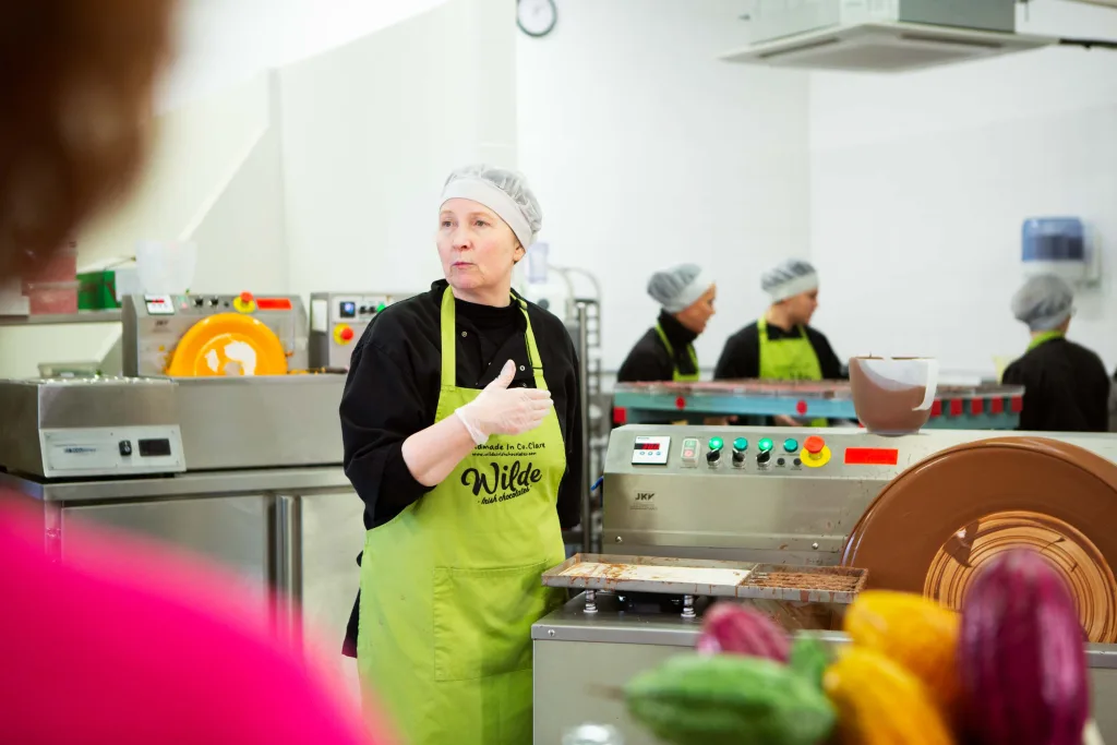 Visiting an artisan chocolate factory with chocolatiers in the background