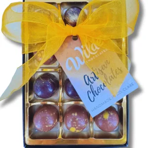 12 Dome Shaped assorted Handpainted dark and milk chocolate truffles in a box tied with a yellow ribbon